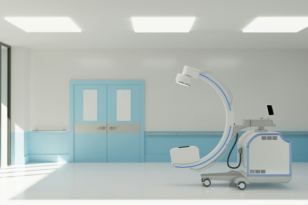 clean operating room with C arm and medical equipment