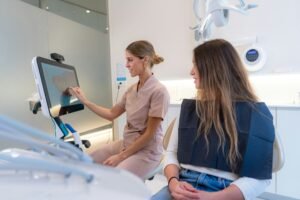 Dentist using modern technology to explain procedure to a patient